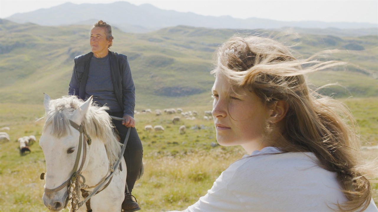 Young woman and a woman on a horse